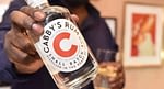 Cabby's Rum bottle in hand